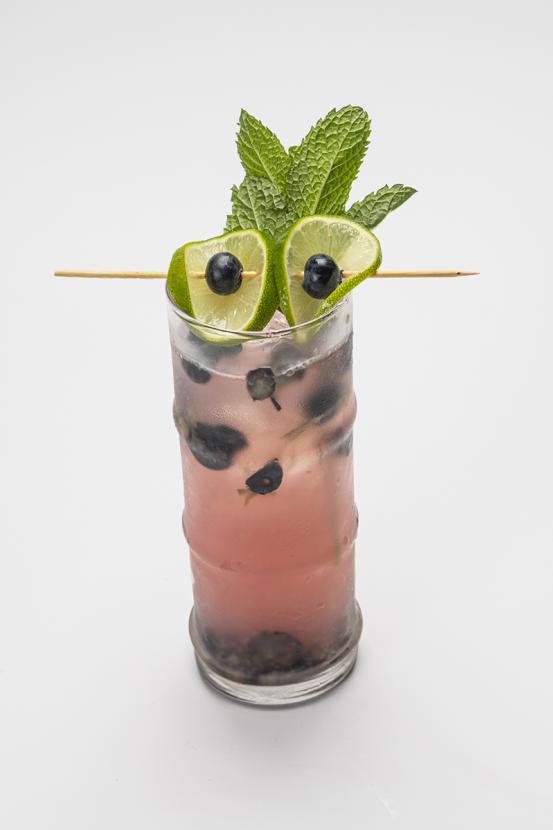 cocktail with limes decorated to look like eyes